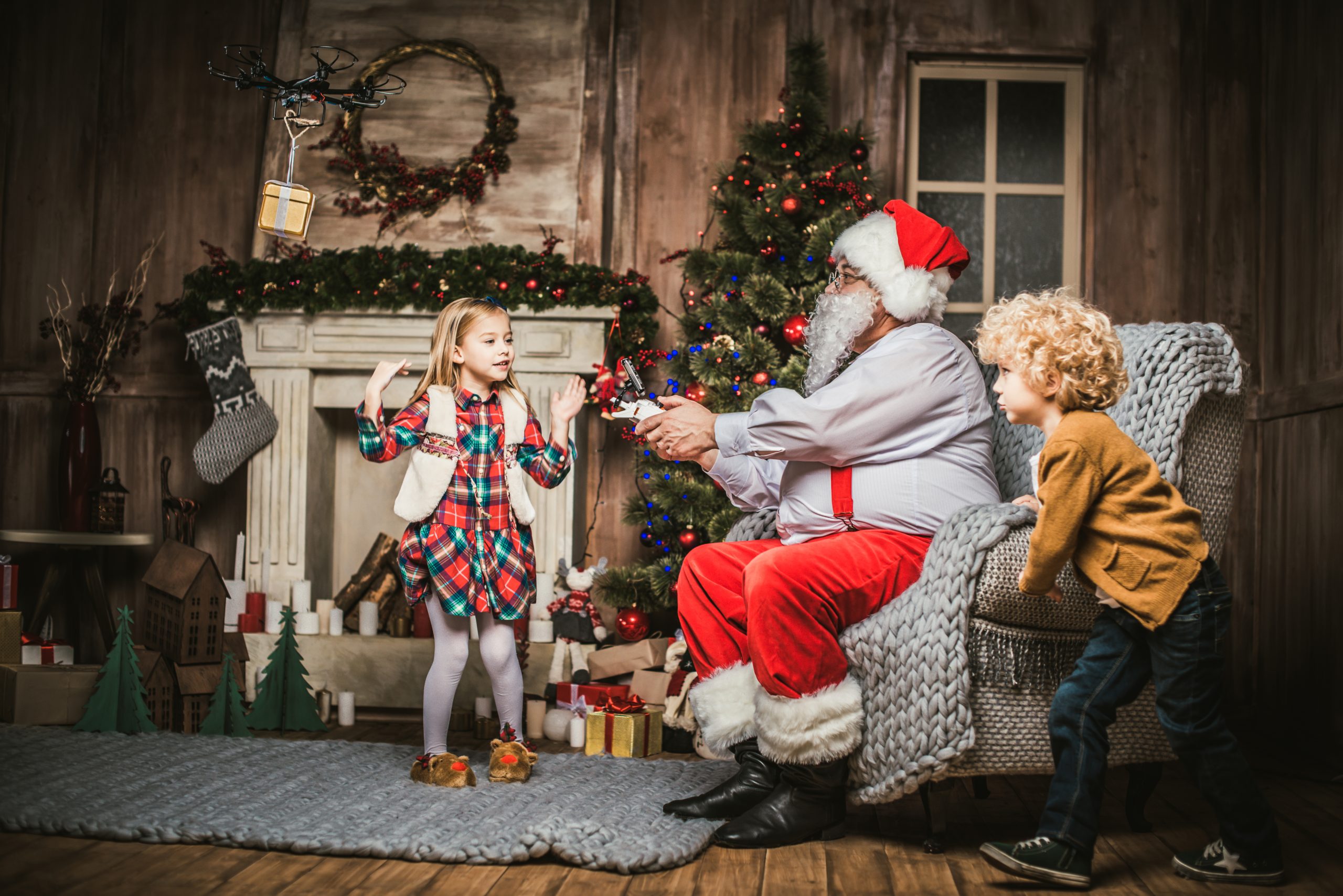 Santa Claus with children using hexacopter drone